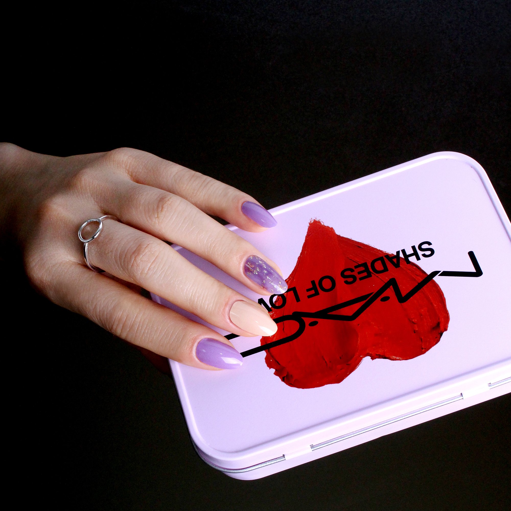 Love Lavender self-adhesive nail polish strips in various sizes, showcasing creative designs and a glossy finish.