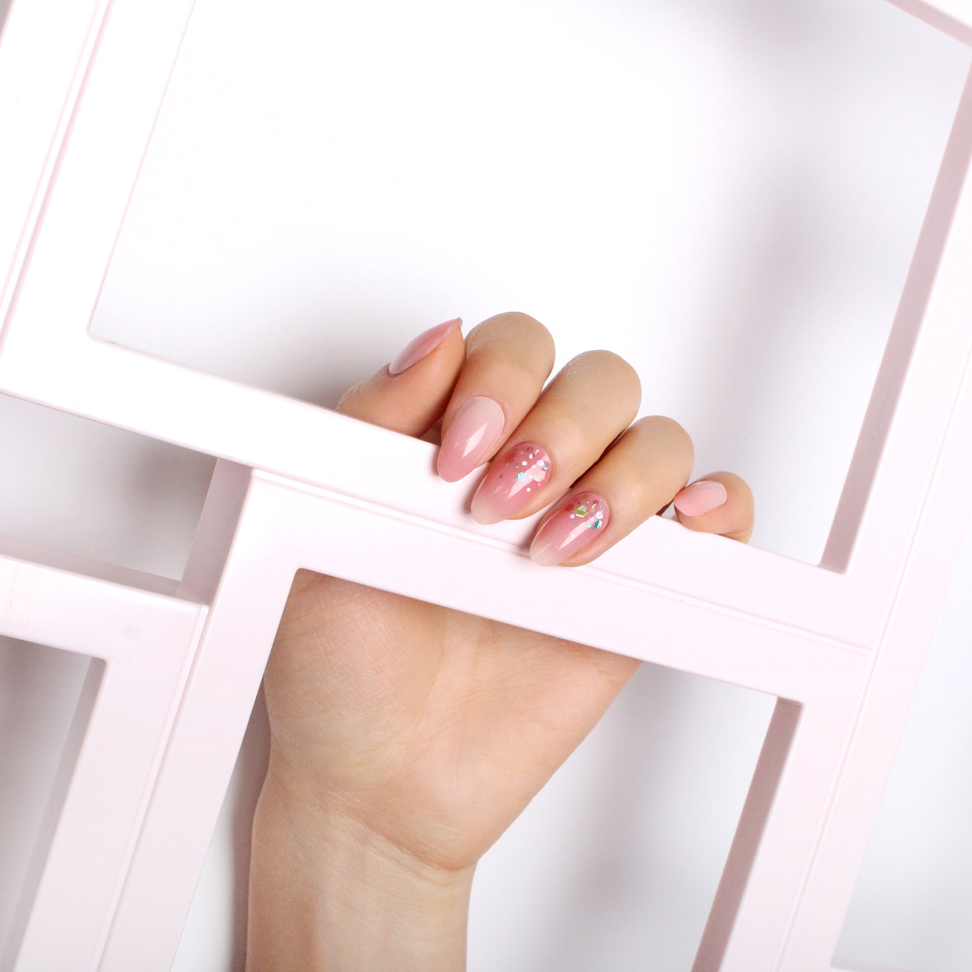 Pink Melody nail polish strips in various sizes, showcasing creative designs and vibrant colors for a stylish manicure.