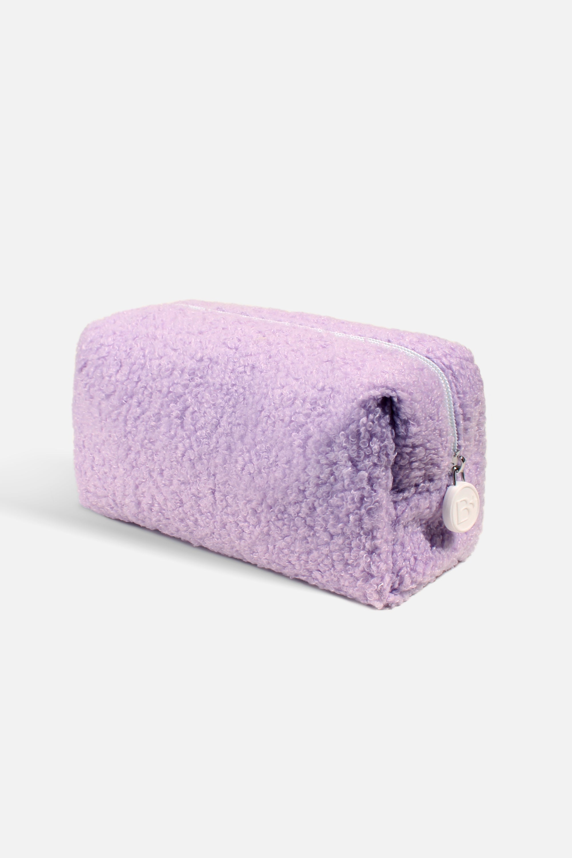 A soft and fluffy Polar Puff Pouch in cream and pastel purple, featuring a chic checkered interior design.