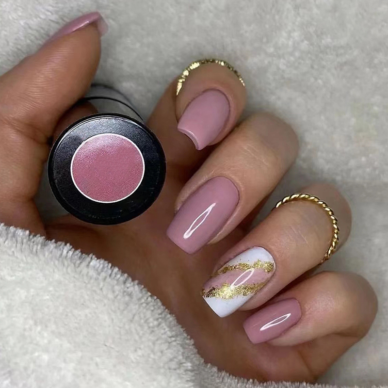 A complete Press On Nails Kit featuring 24 reusable nails, nail glue, gel stickers, and essential tools for easy application, all neatly organized in a storage box.