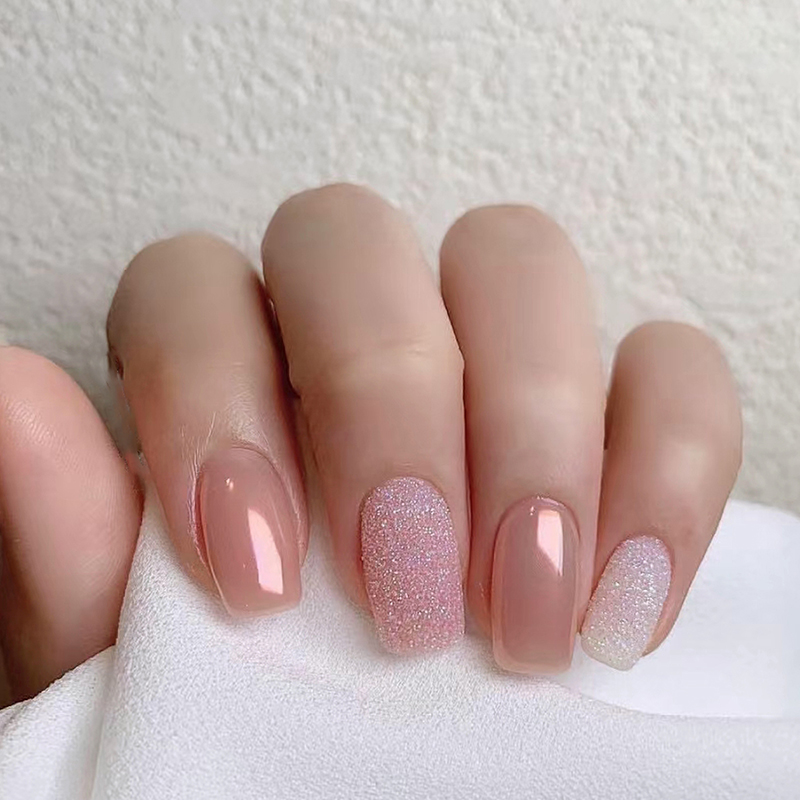 A colorful Press On Nails Kit featuring 24 reusable nails, nail glue, gel stickers, and essential nail care tools in a stylish storage box.