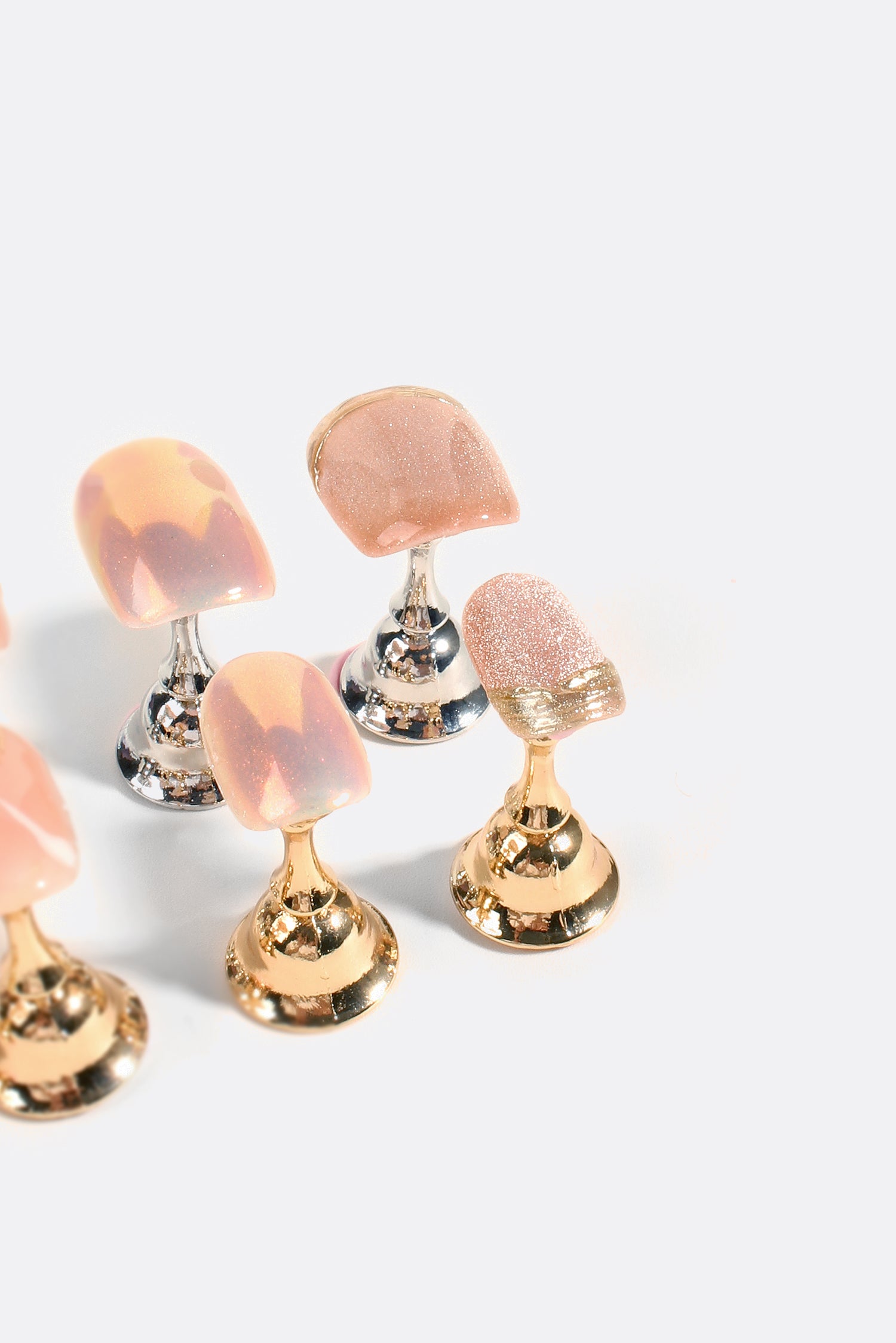 A set of Rose Gold Rush Pro Handmade Gel Nails featuring a shimmering rose gold finish with glittering and metallic accents.