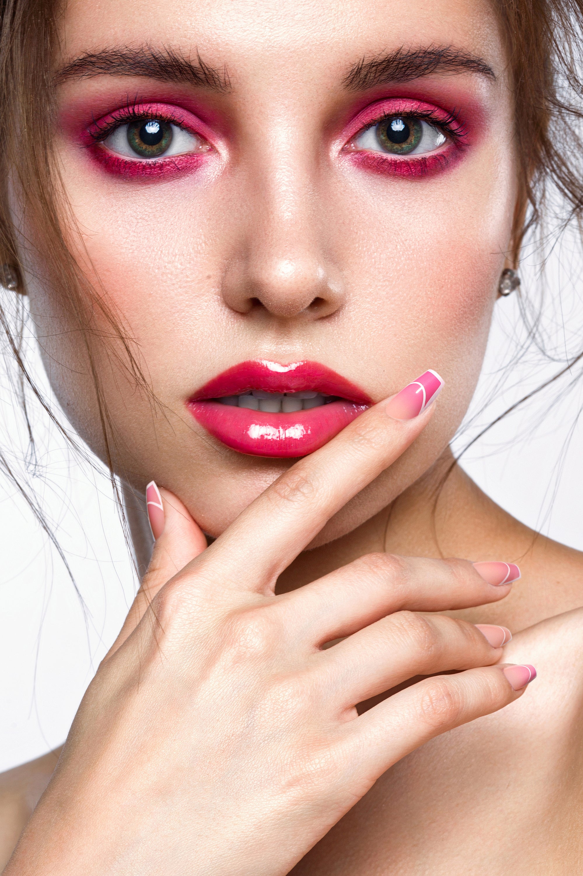 Rose Rhapsody press-on nails featuring a gradient from rich rose to pale pink, showcasing a smooth rounded shape and shiny finish.