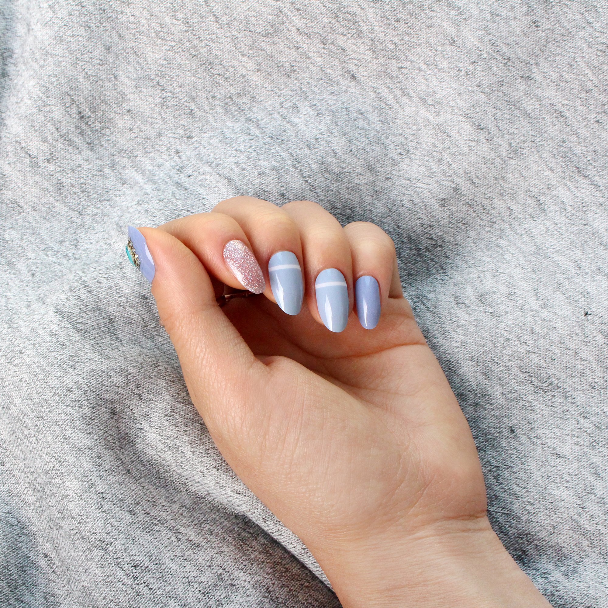 Sky Dream nail polish strips featuring various creative designs in a pack, showcasing vibrant colors and patterns.