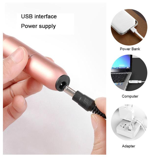 USB Nail Drill Set in rose gold color with six metal bits and USB power cord, ideal for portable nail care.