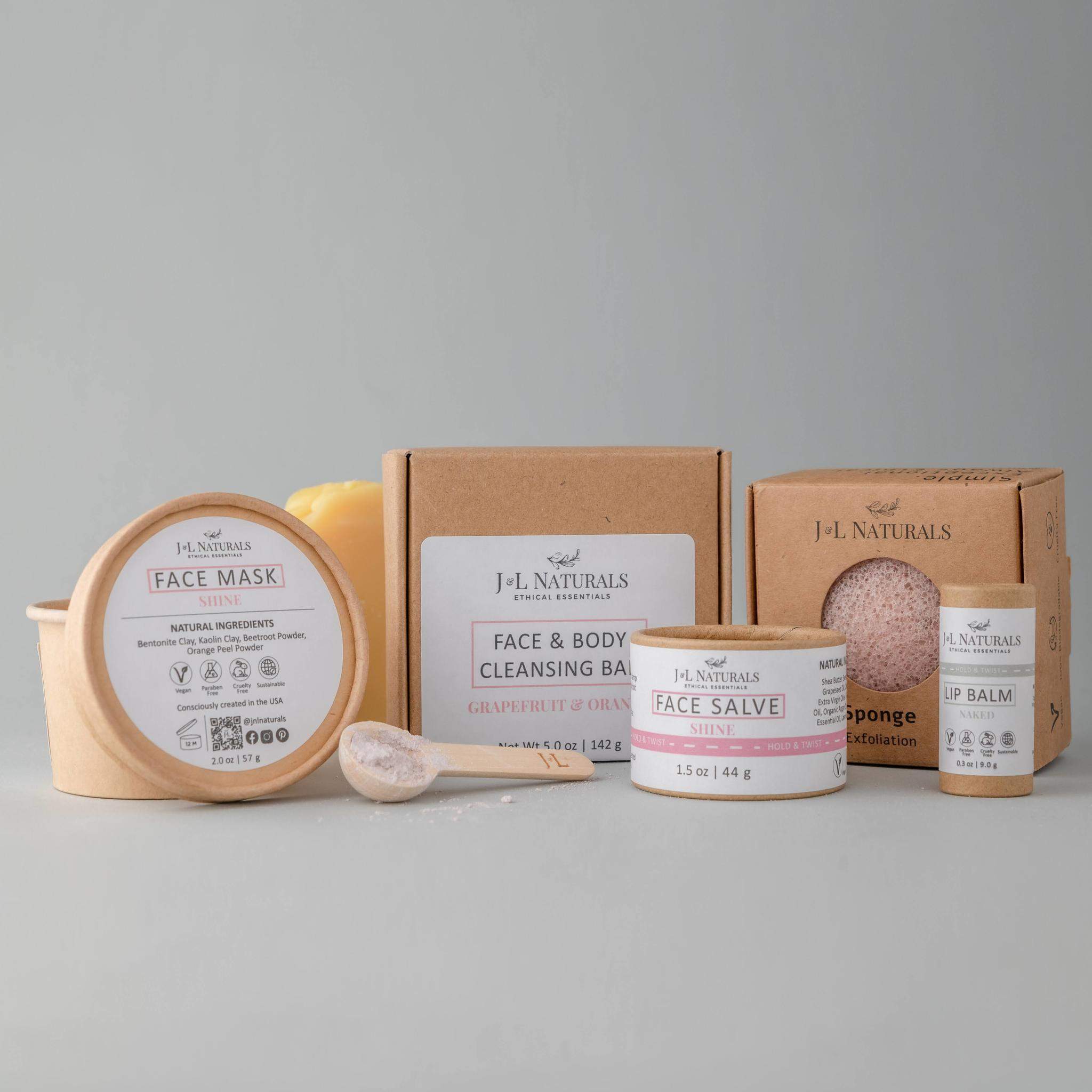 Advanced Skin Regimen Kit featuring five skincare products including cleansing bar, konjac sponge, face salve, face mask, and lip balm.