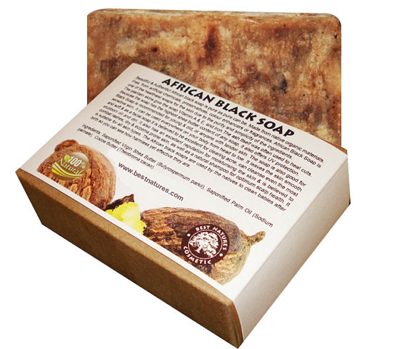 A bar of African Black Soap made from natural ingredients, showcasing its rich, dark color and rustic texture, symbolizing traditional West African craftsmanship.