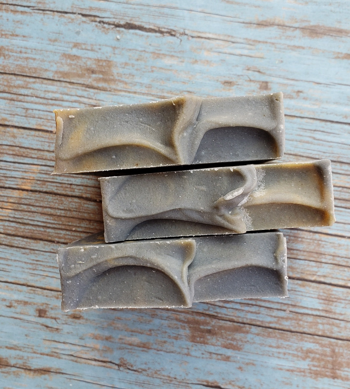 Antiseptic Handmade Soap bar with organic ingredients, showcasing its unique texture and color variations.