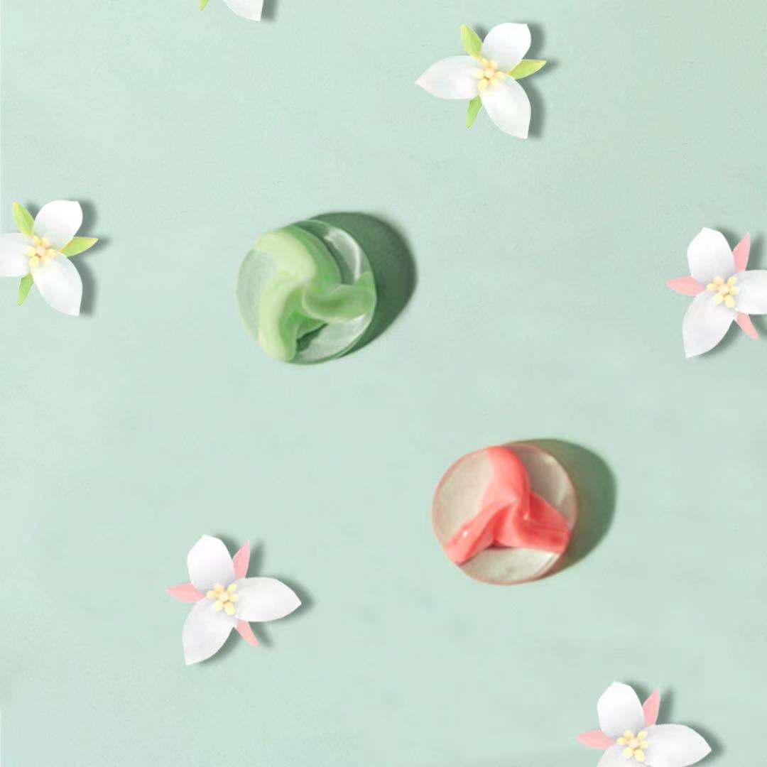 Colorful soaps with flower decorations.
