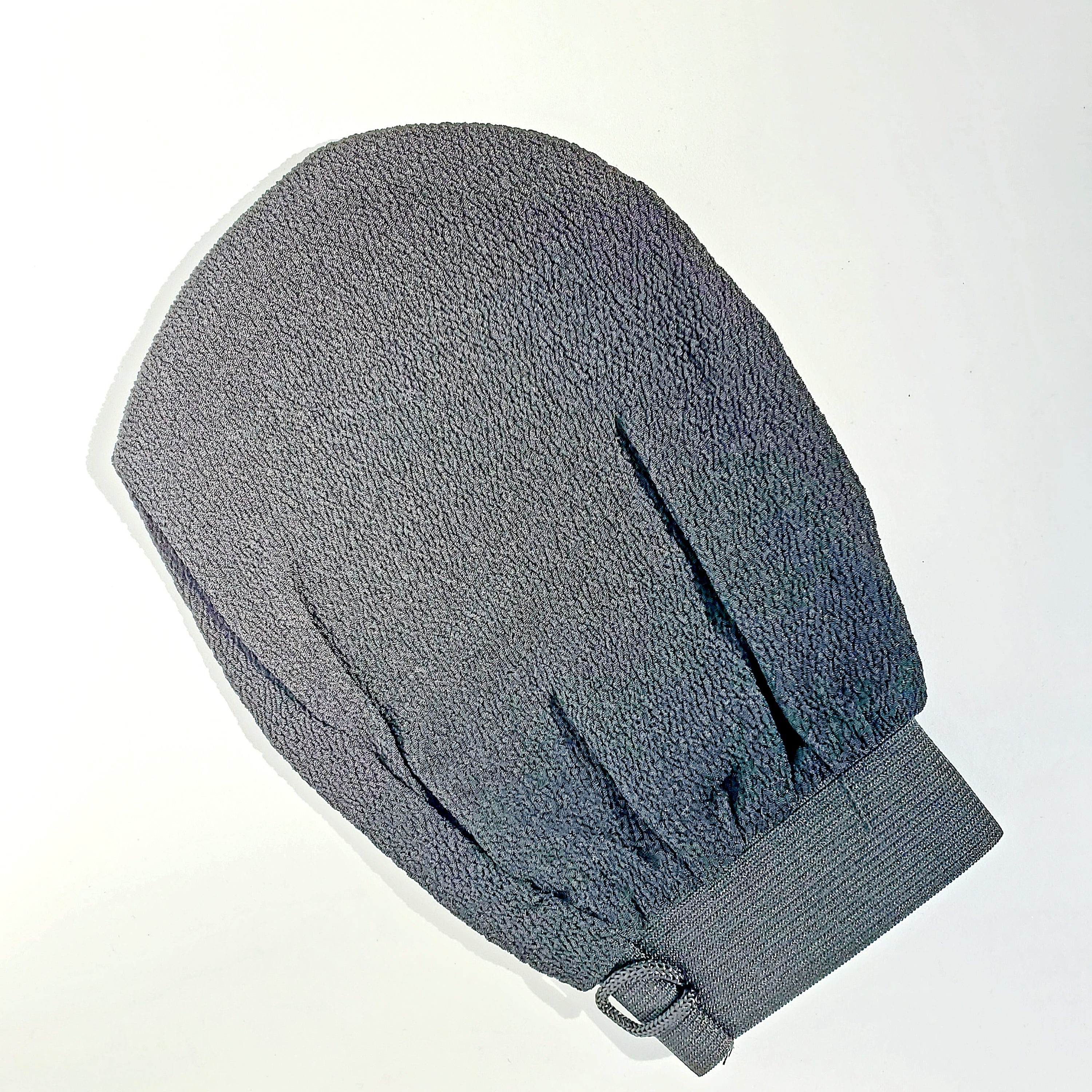 Exfoliating Glow Body 2pc Glove Set showcasing two handcrafted gloves with a traditional weaving design for effective exfoliation.