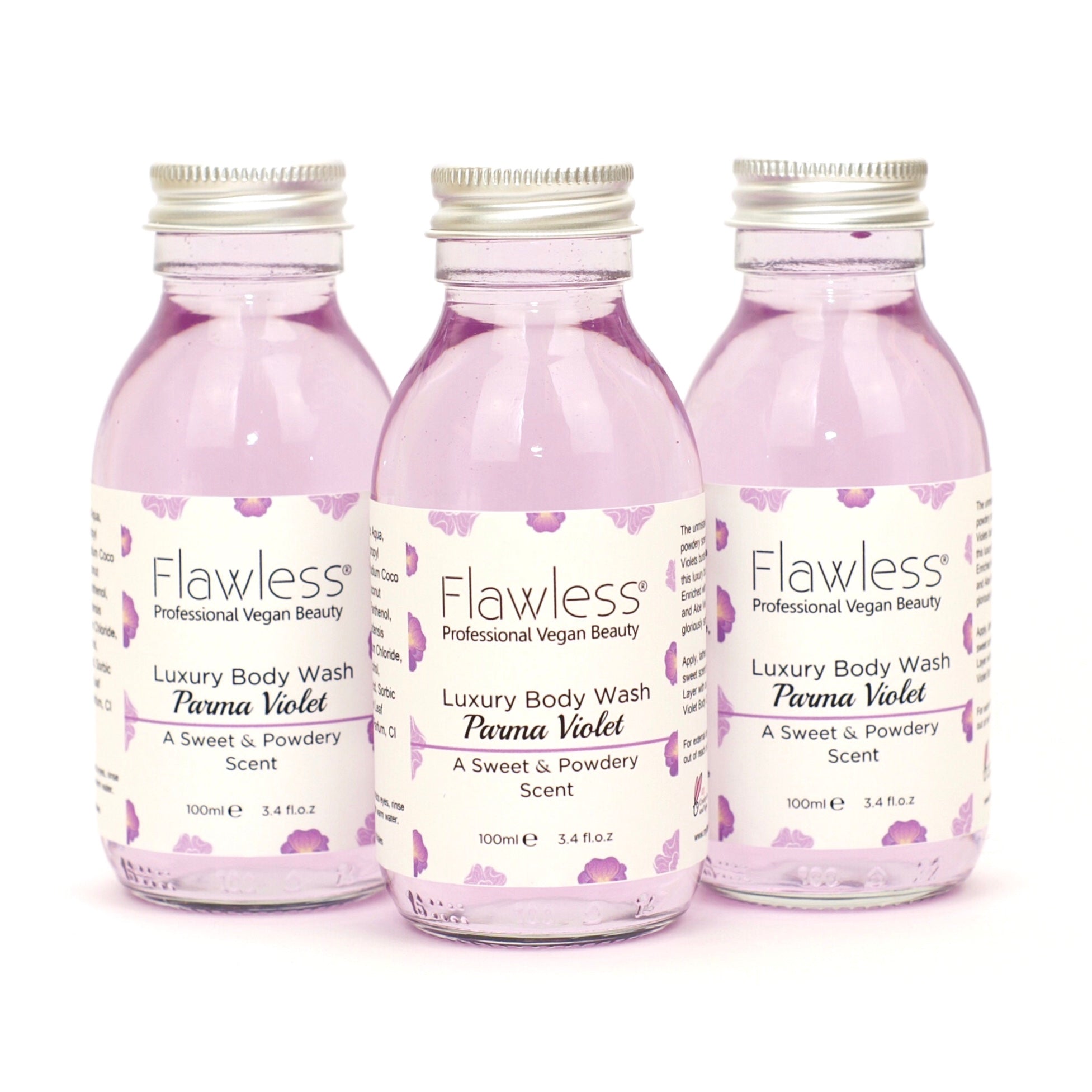 A luxurious Parma Violet body wash in a recycled glass bottle with an aluminum lid, showcasing its creamy texture and vibrant color.