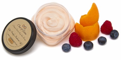 Citrus Berri Whipped Body Cleanser in a stylish container, showcasing its whipped mousse texture and vibrant citrus color.