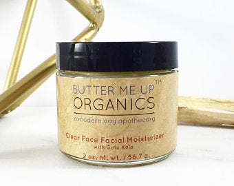 A jar of organic face cream moisturizer with natural ingredients, showcasing its rich texture and eco-friendly packaging.
