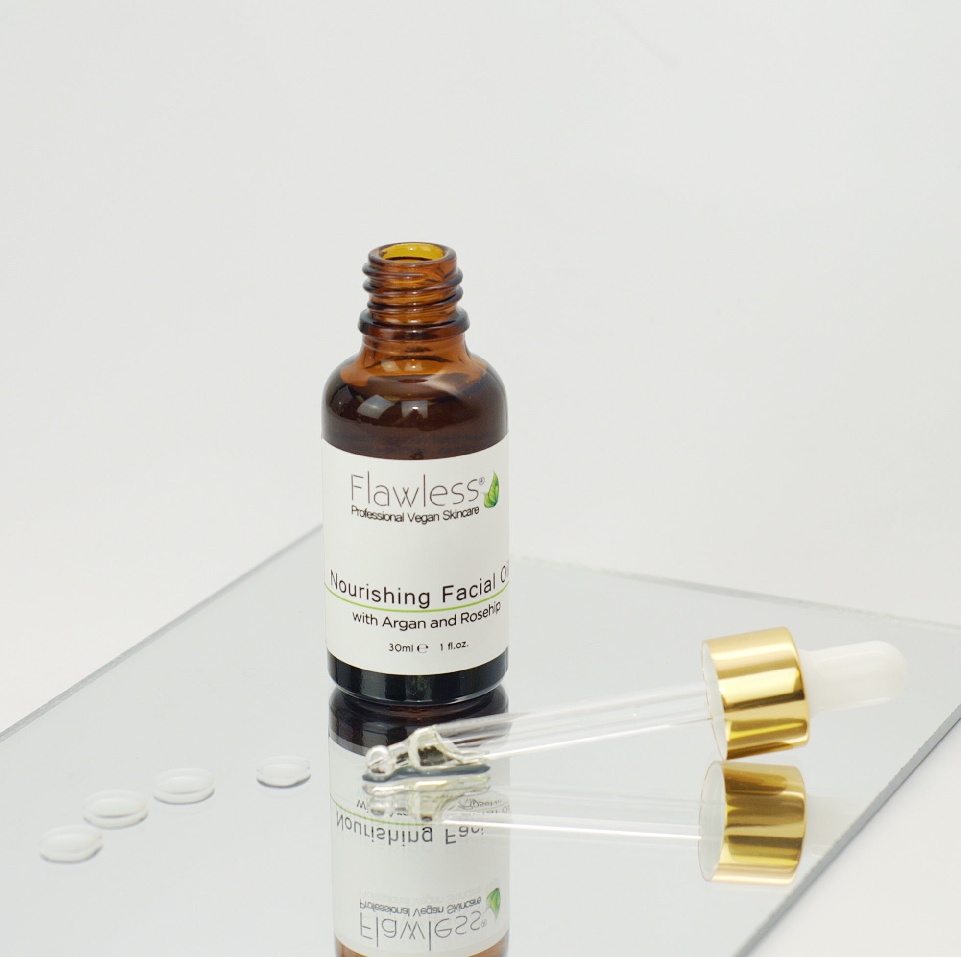 30ml bottle of luxurious facial oil with rosehip, argan, and neroli, featuring a glass dropper for easy application.
