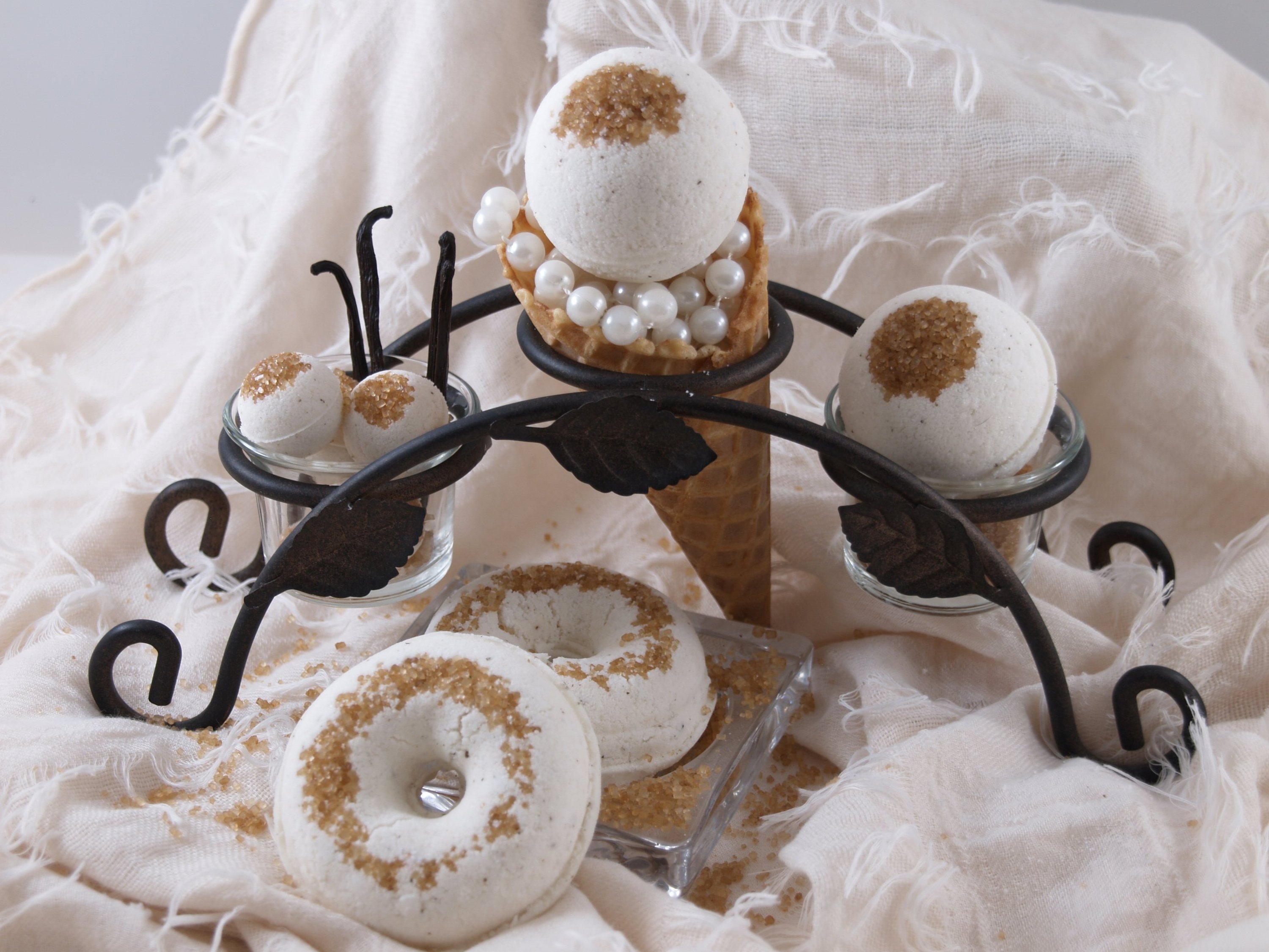 A vibrant French Vanilla Bath Bomb with a walnut topping, showcasing its effervescent and aromatic qualities, perfect for a relaxing bath experience.