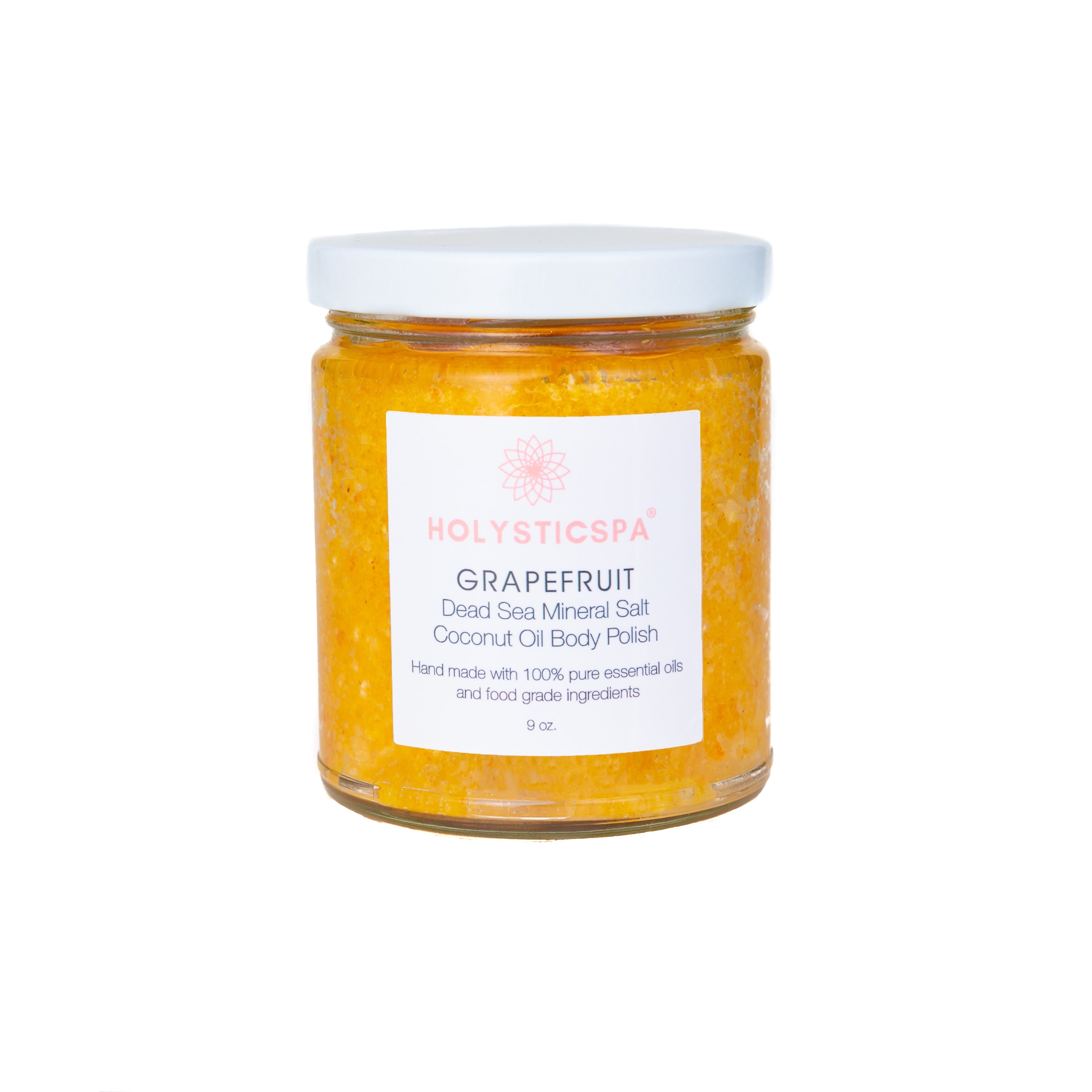 Grapefruit Body Polish in a jar with natural ingredients like Dead Sea salt and coconut oil, showcasing its exfoliating properties.