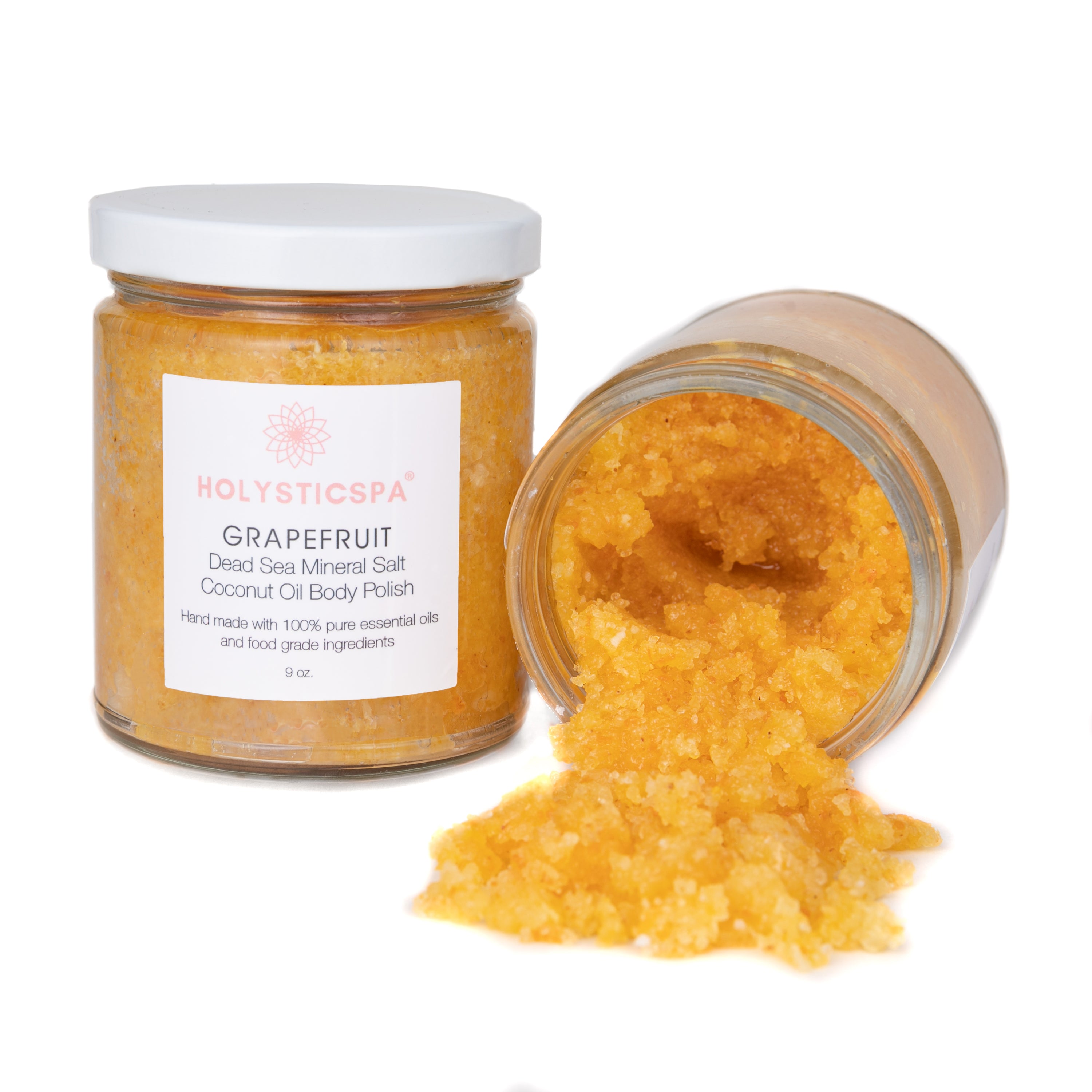 Grapefruit Body Polish in a jar with natural ingredients like Dead Sea salt and coconut oil, showcasing its exfoliating properties.
