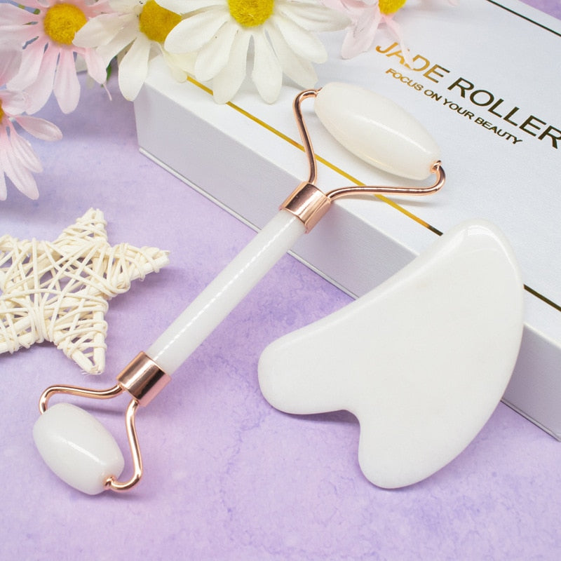 GuaSha Massage Roller Scraper made of natural rose quartz, designed for face lifting and body relaxation, showcasing its elegant design and color variations.