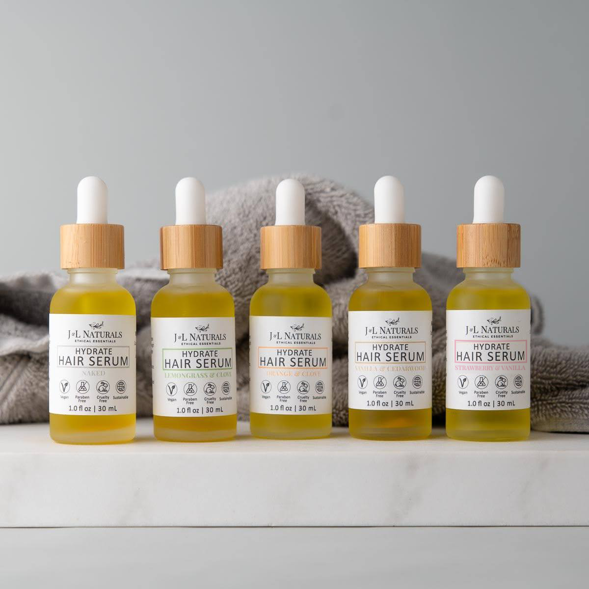 Hair Serum Bundle (5-Pack) featuring various serums for different hair types in elegant packaging.