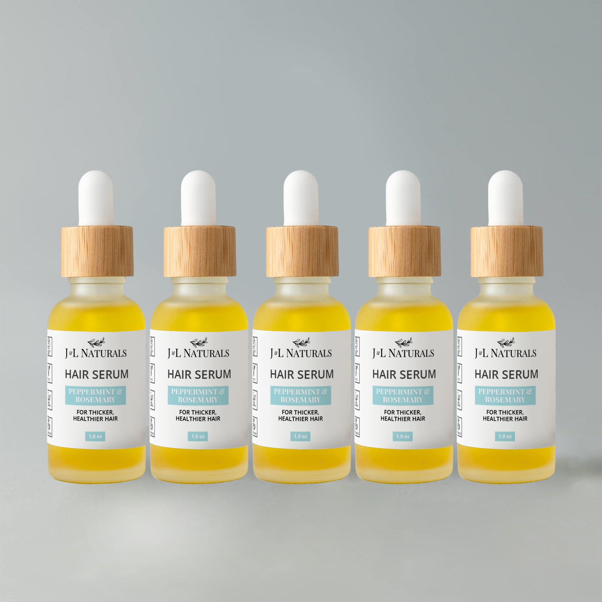 Hair Serum Bundle (5-Pack) featuring various serums for different hair types in elegant packaging.