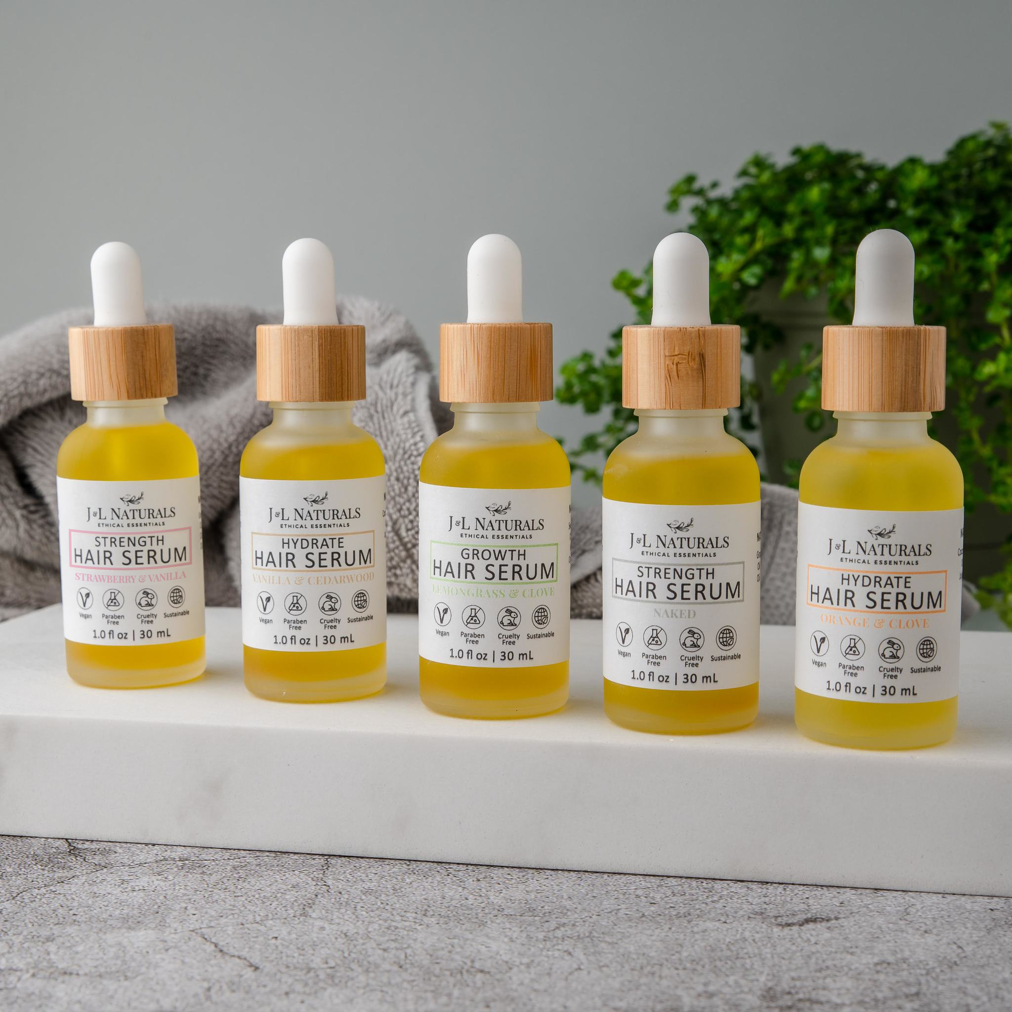 Hair Serum Bundle (5-Pack) featuring various serums for different hair types in elegant packaging.