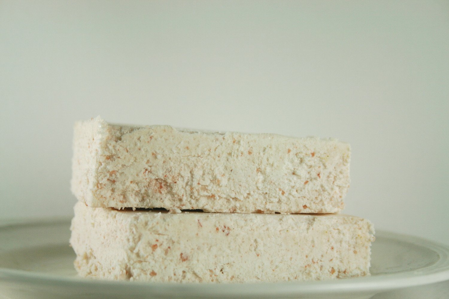 Himalayan Salt Soap bar with essential oils, showcasing its pink hue and natural texture.