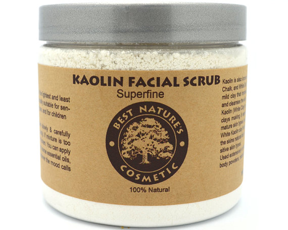 A jar of Kaolin Facial Scrub, showcasing its creamy white texture, ideal for sensitive skin types, surrounded by natural ingredients.