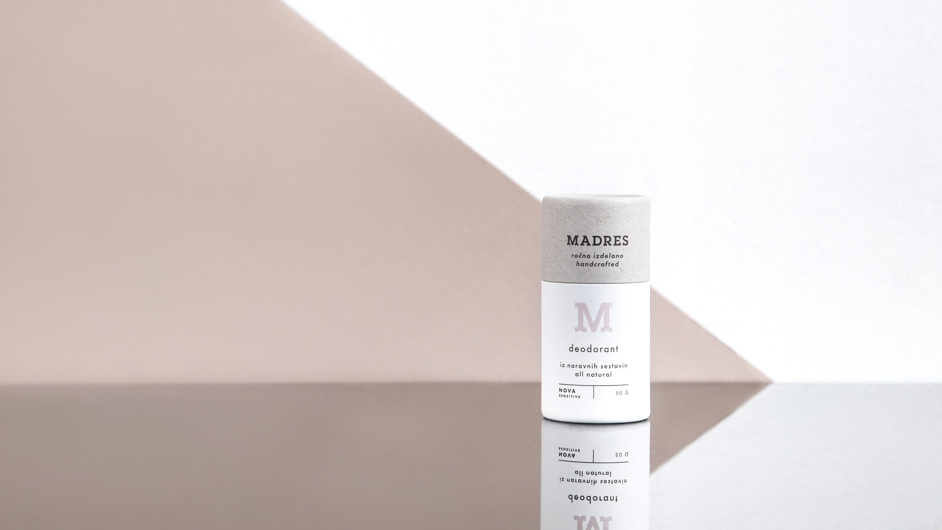 Madres Nova Sensitive natural deodorant in eco-friendly packaging, showcasing its creamy texture and floral essence.