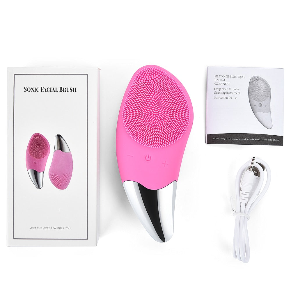 Mini Electric Facial Cleansing Brush in pink color, showcasing its soft bristles and ergonomic design for deep pore cleansing.