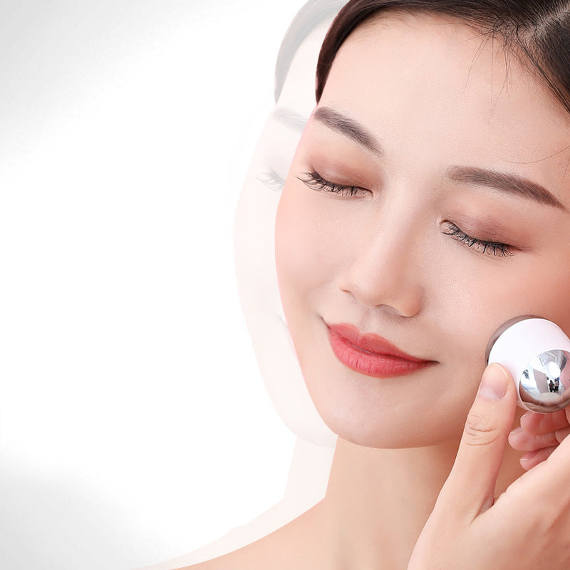 Mini Facial Massage Vibration Skin Tightening Massager with silver electroplating and compact design for easy portability.