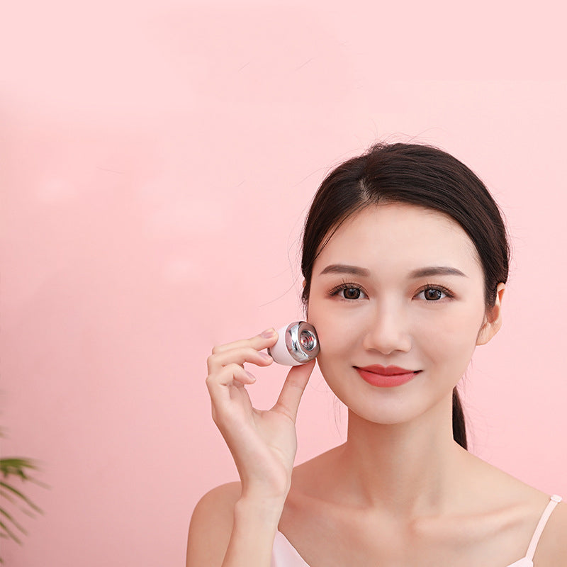 Mini Facial Massage Vibration Skin Tightening Massager with silver electroplating and compact design for easy portability.