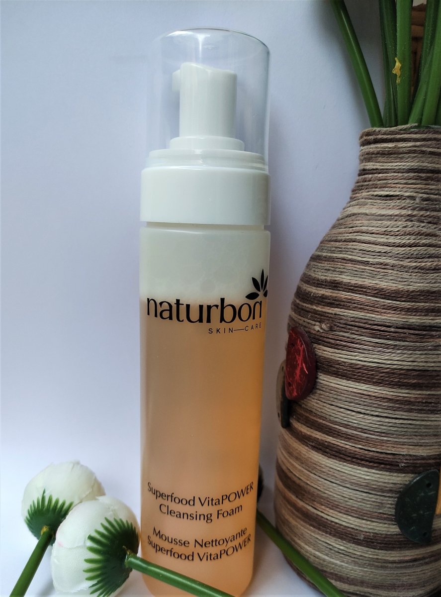 Naturbon Superfood VitaPOWER Cleansing Foam Face Wash in a sleek 200ml bottle, showcasing its creamy texture and vibrant fruit ingredients.