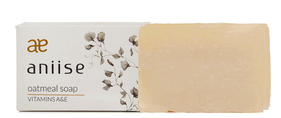 A bar of oatmeal soap with a creamy texture, showcasing its natural ingredients and gentle formulation for sensitive skin.