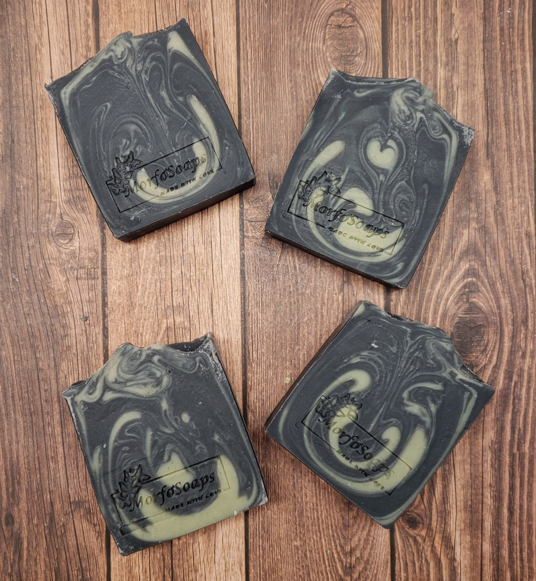 Handmade Patchouli & Frankincense Soap bar with natural ingredients, featuring a rich earthy color and unique texture.