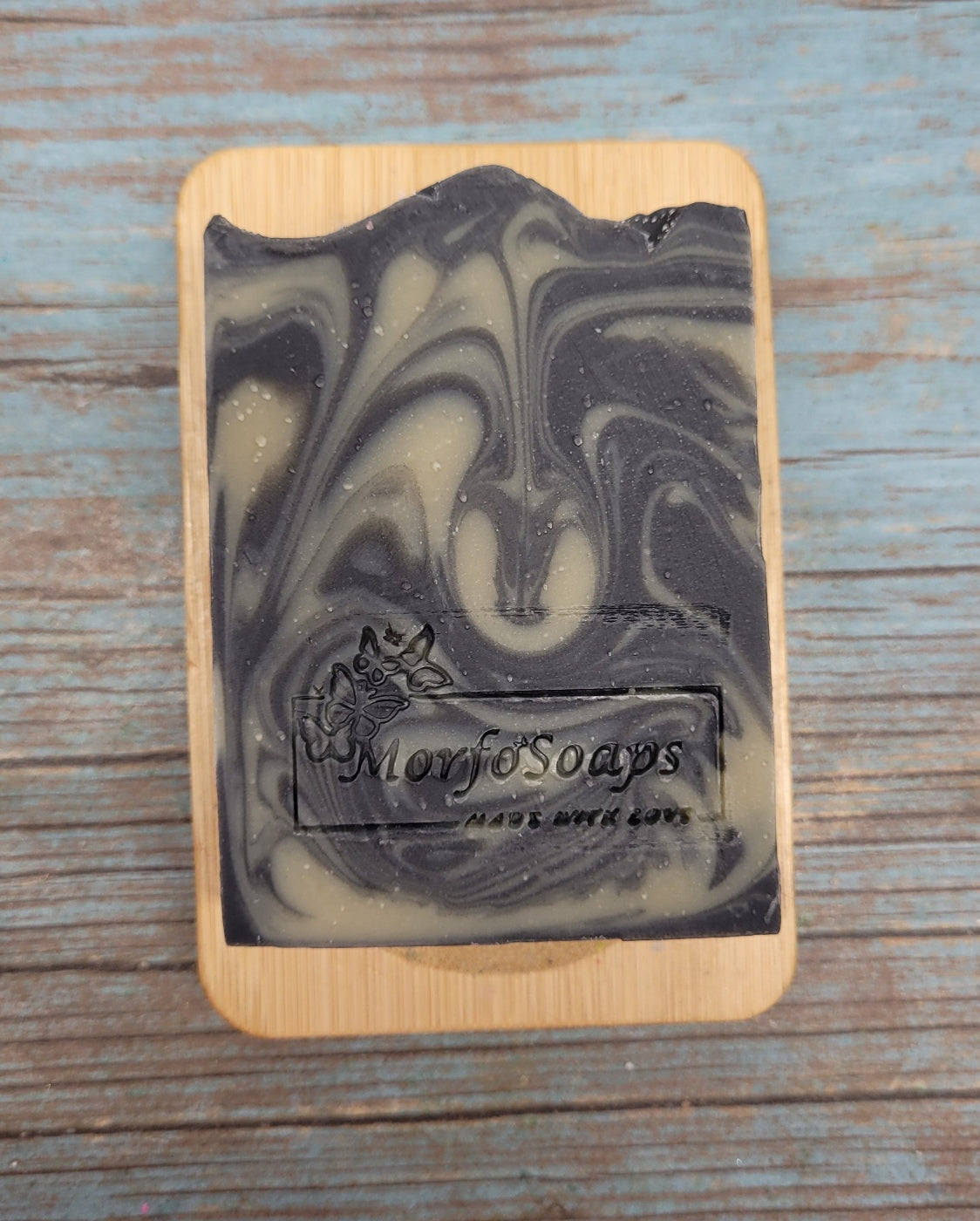 Handmade Patchouli & Frankincense Soap bar with natural ingredients, featuring a rich earthy color and unique texture.