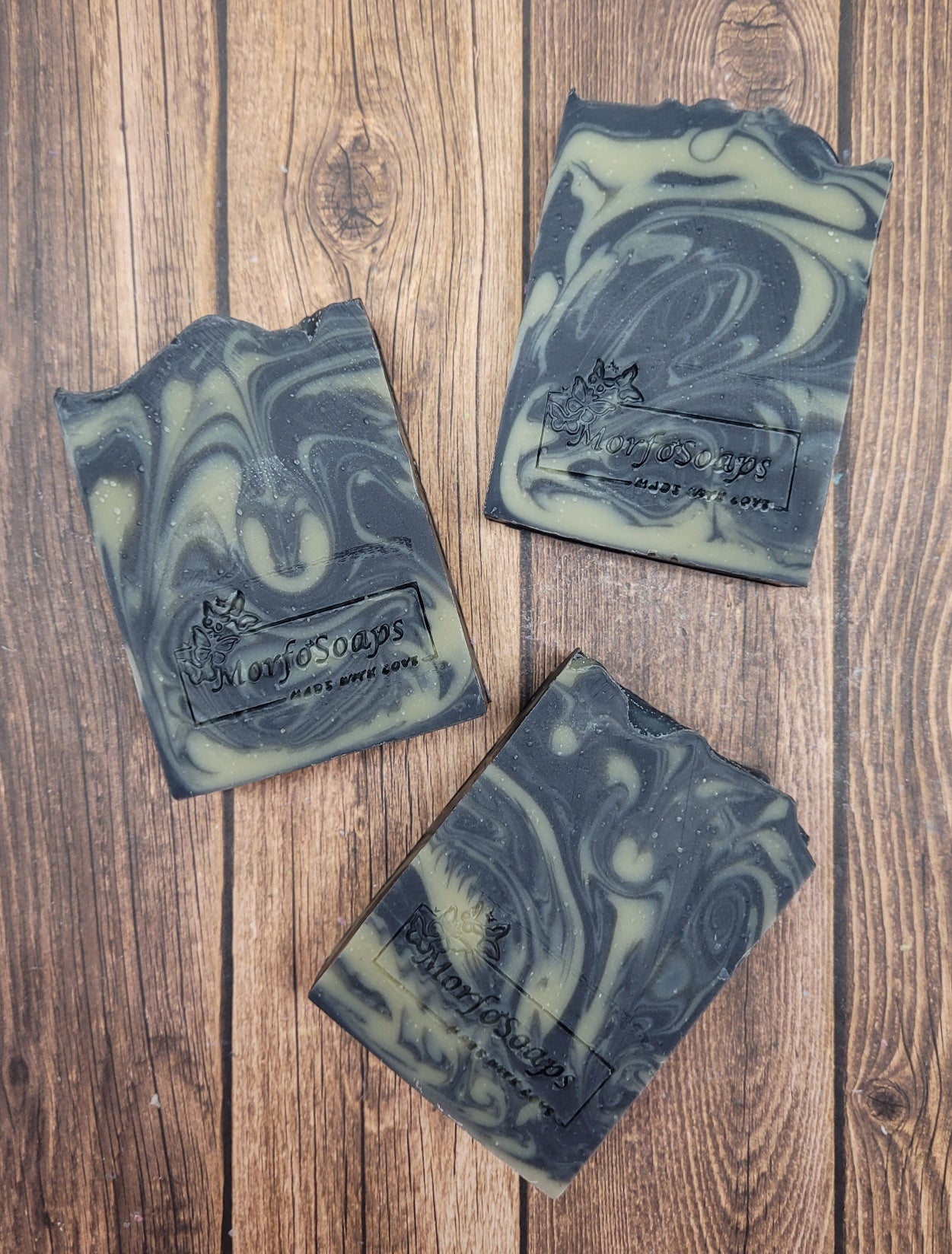 Handmade Patchouli & Frankincense Soap bar with natural ingredients, featuring a rich earthy color and unique texture.