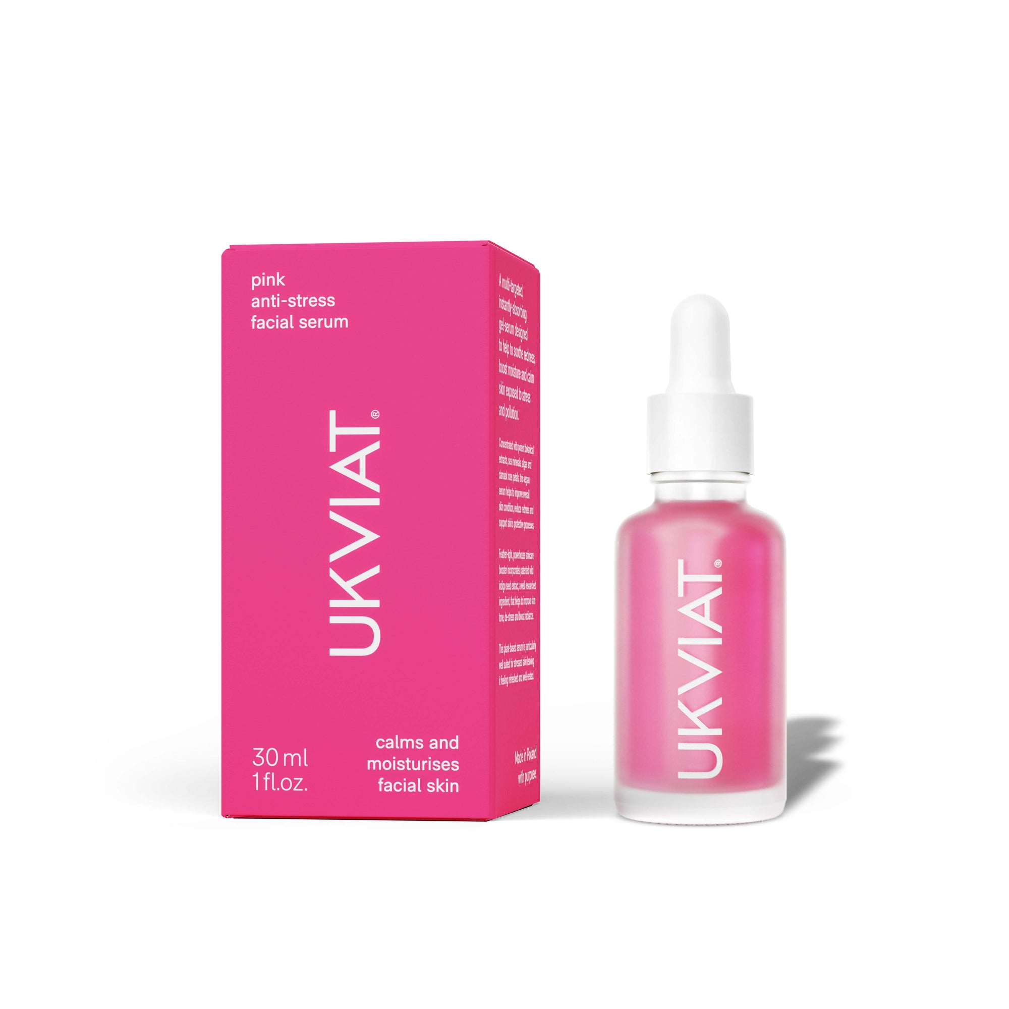 A bottle of pink anti-stress facial serum with botanical extracts, featuring a sleek design and a dropper for easy application.