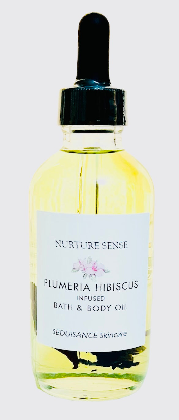 Plumeria Hibiscus Infused Bath & Body Oil bottle with natural hibiscus flower buds and plumeria essential oil.