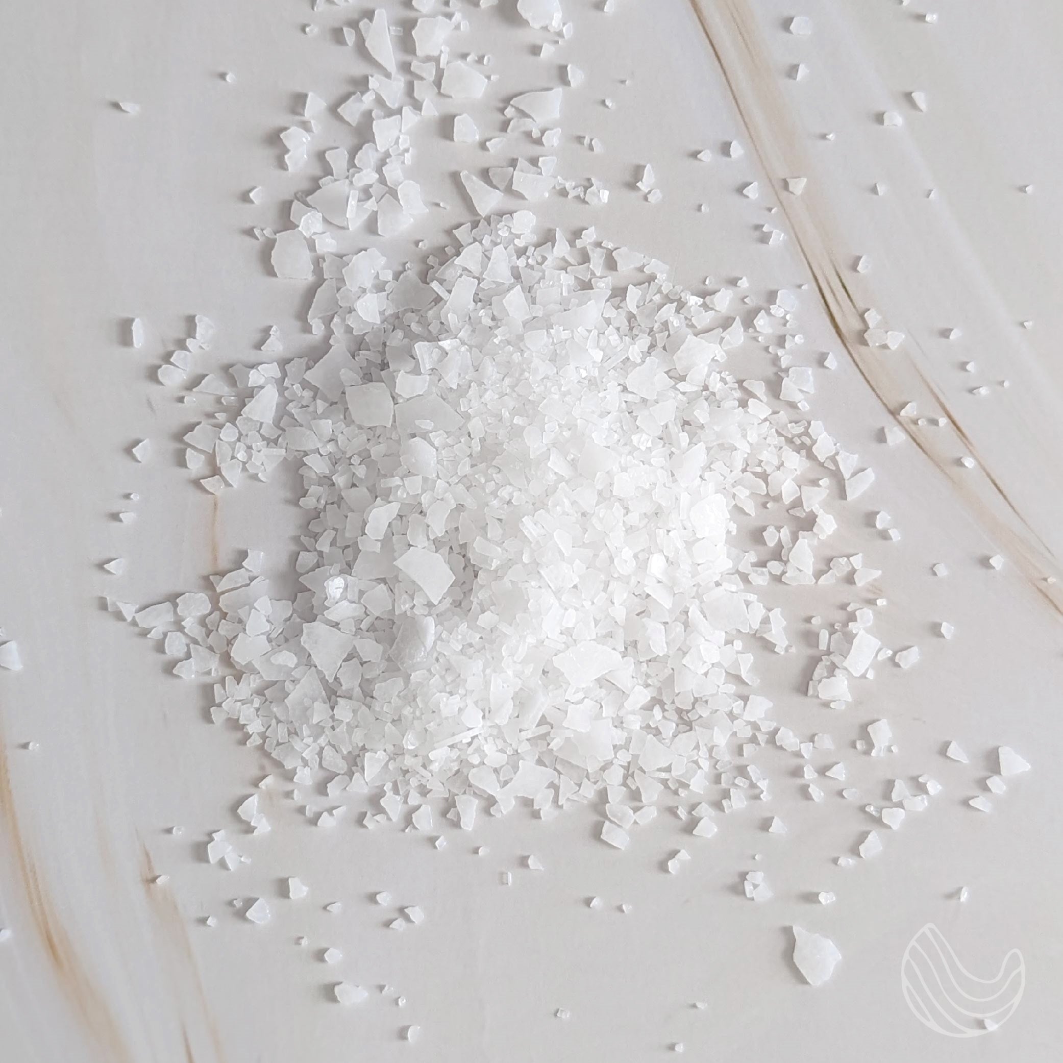 A packet of Pure Dead Sea Magnesium Flakes Peace of Mind Soak, showcasing the product's luxurious packaging and natural ingredients.