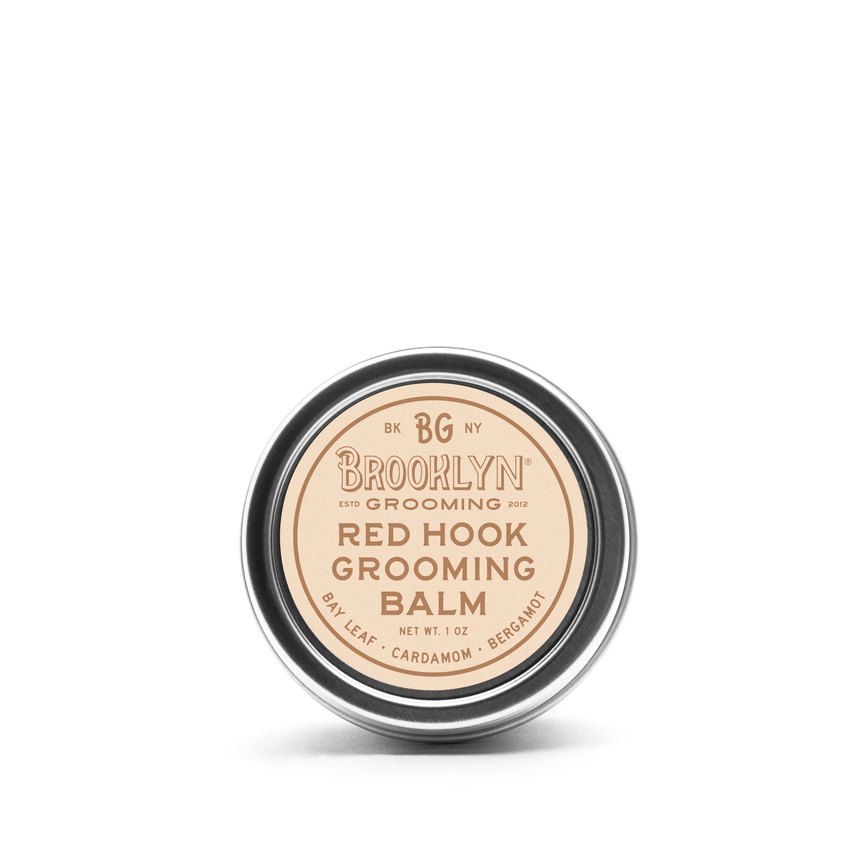 Red Hook Grooming Balm in a seamless aluminum tin, showcasing its natural ingredients and spiced bay scent.