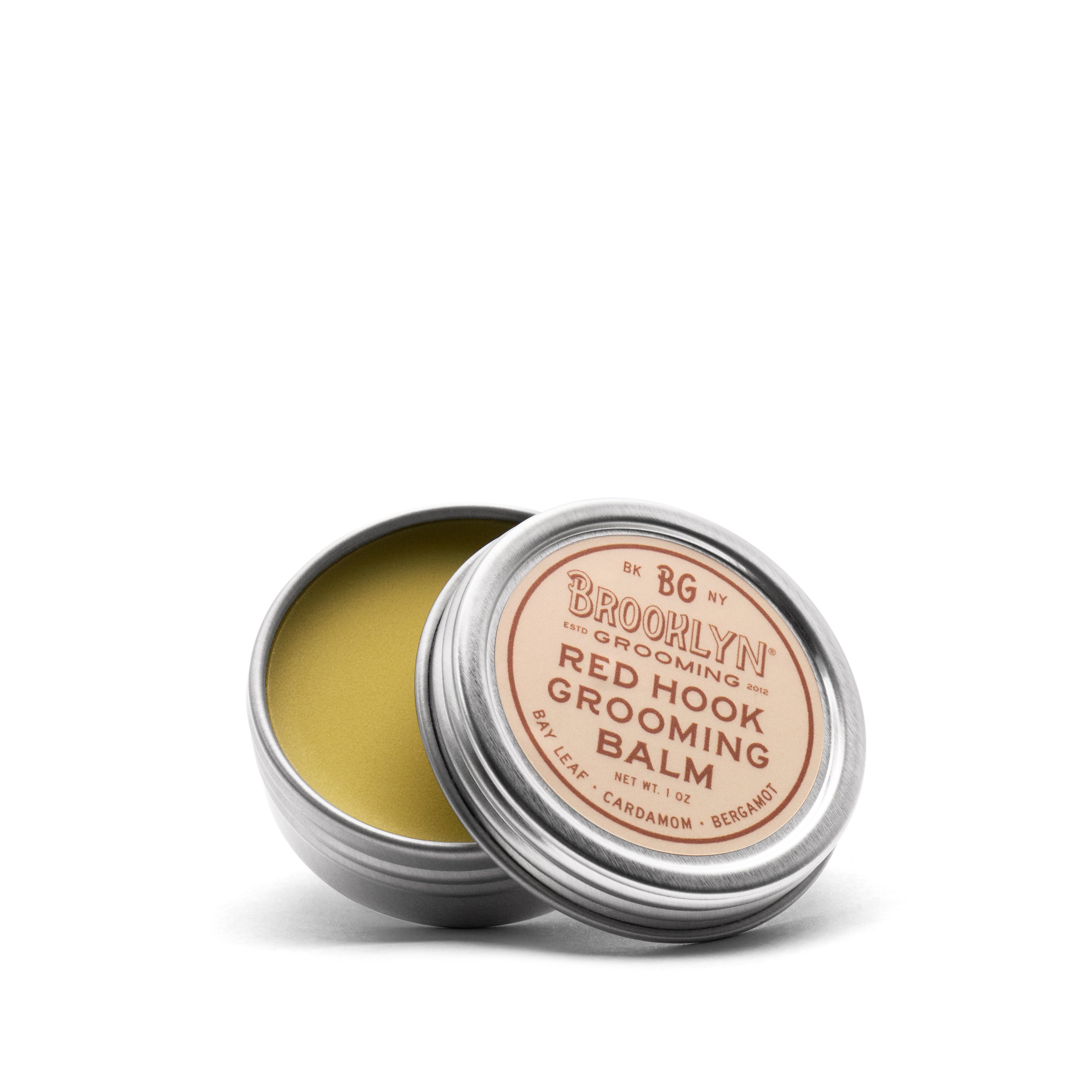Red Hook Grooming Balm in a seamless aluminum tin, showcasing its natural ingredients and spiced bay scent.