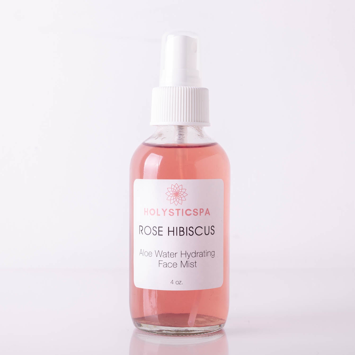 A bottle of Rose Hibiscus Aloe Water Hydrating Face Mist with floral design, showcasing its hydrating properties.