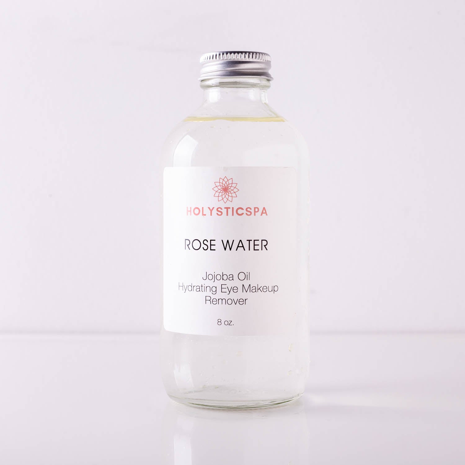 A bottle of Rose Water Hydrating Makeup Remover with a floral design, showcasing its natural ingredients and gentle formula.