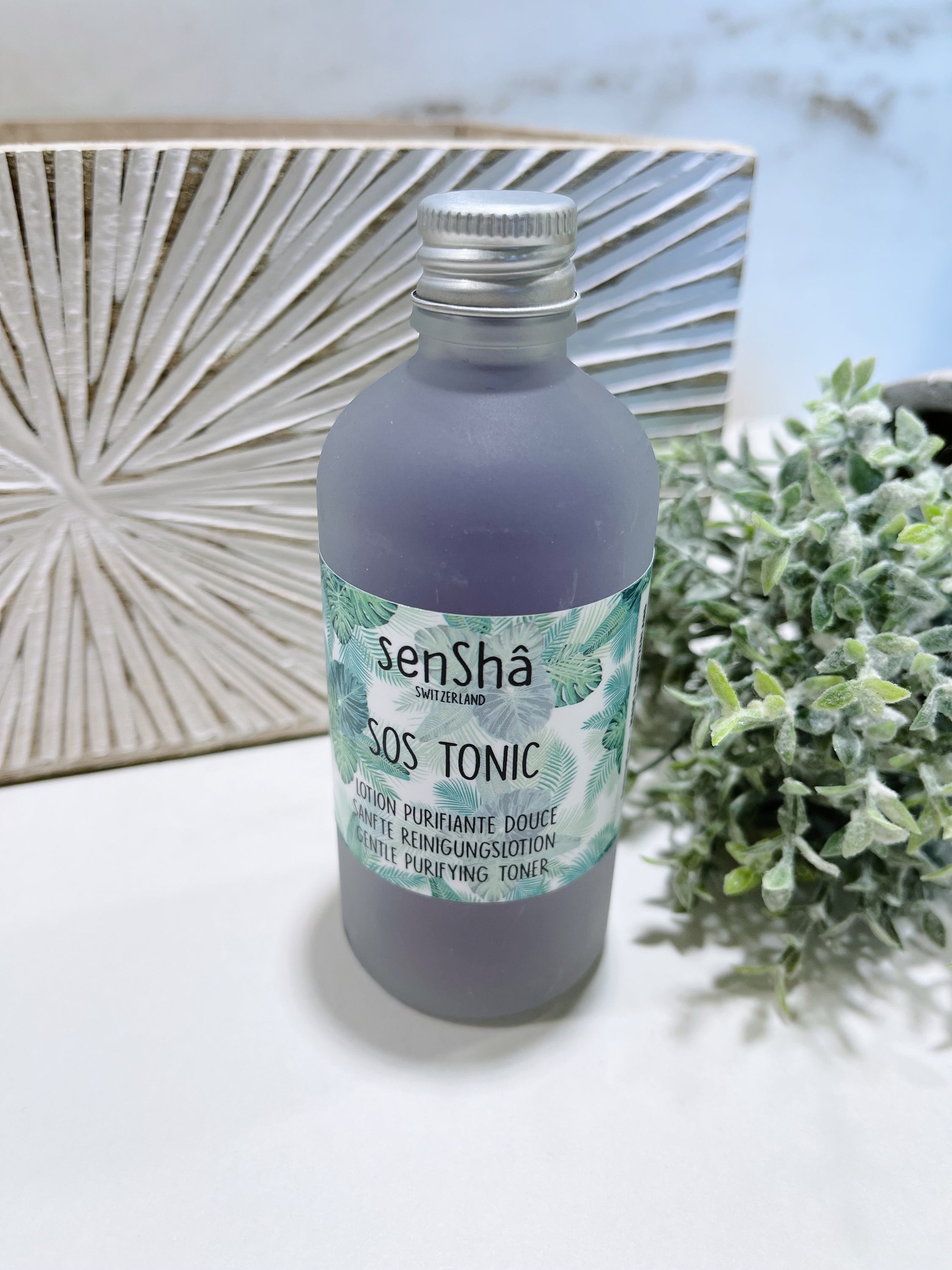 SOS Tonic 100ml lotion for mixed and oily skin, featuring a sleek bottle design with a refreshing mint color.