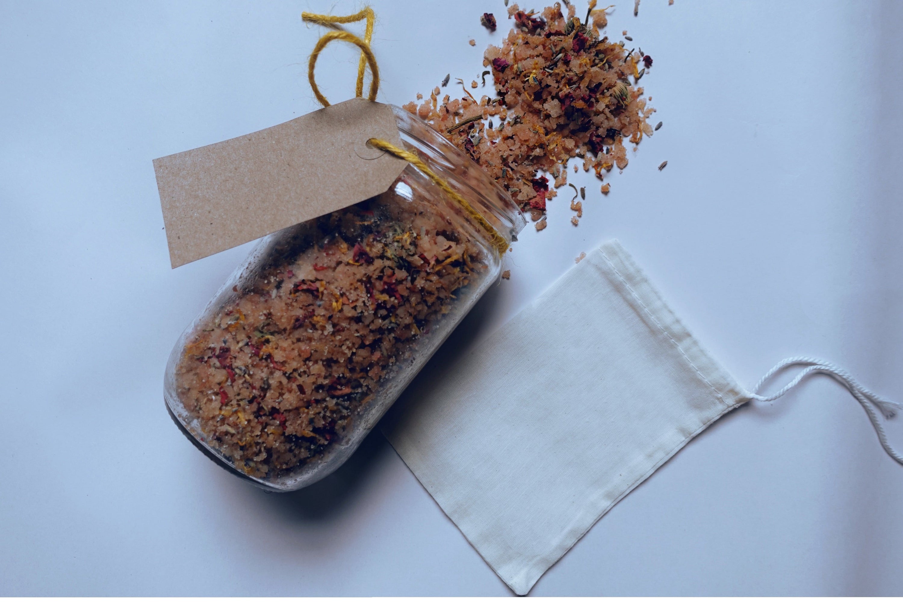 A 500g package of Soothing Bath Soak Salts with Baobab Oil, featuring lavender and rose petals, designed for a relaxing bath experience.