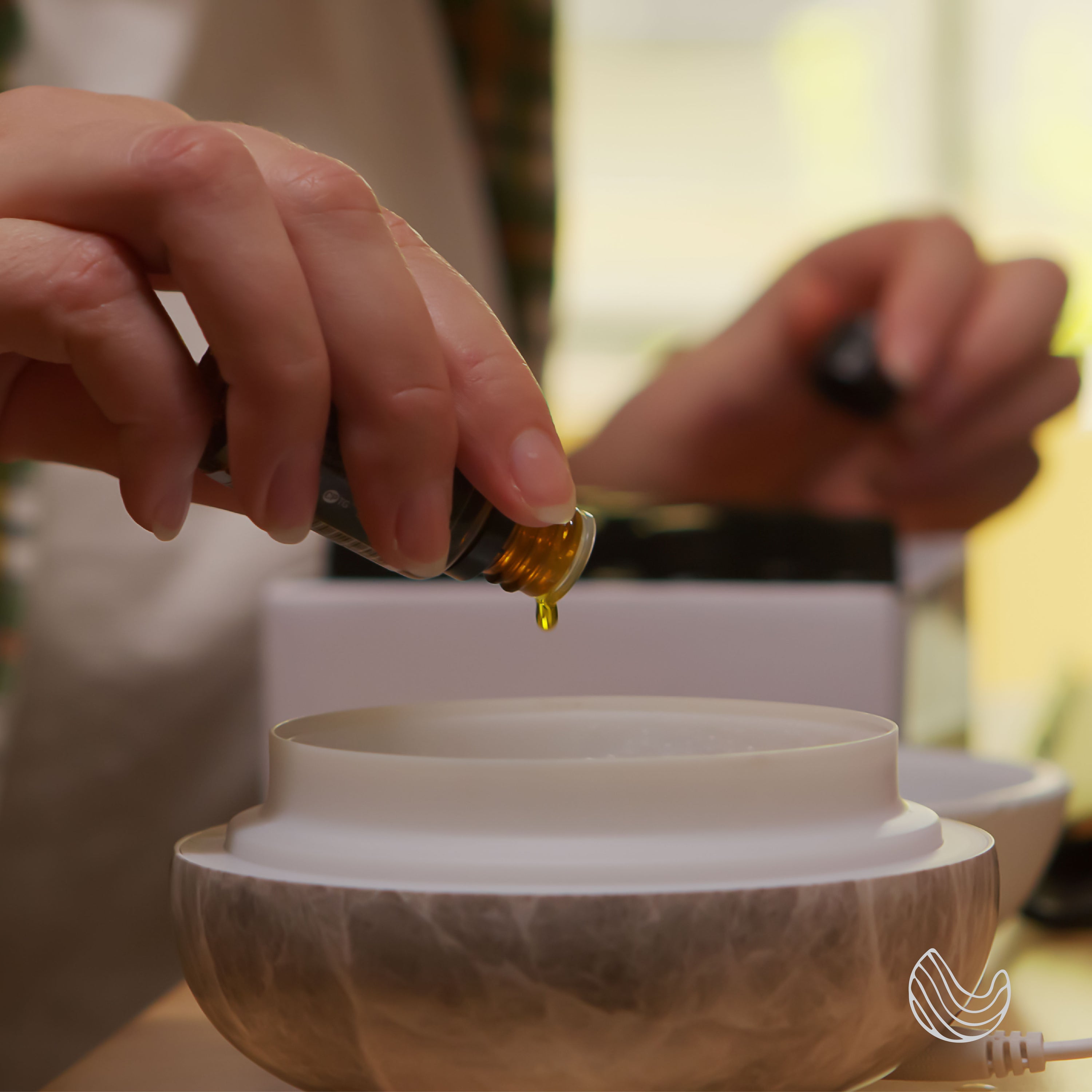 A bottle of Sweet Dreams Essential Oil Blend featuring eucalyptus and lavender, surrounded by calming elements like stones and flowers.