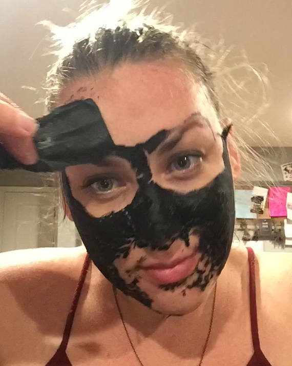 A vegan activated charcoal peel-off mask packet with natural ingredients, showcasing its eco-friendly packaging and easy application method.