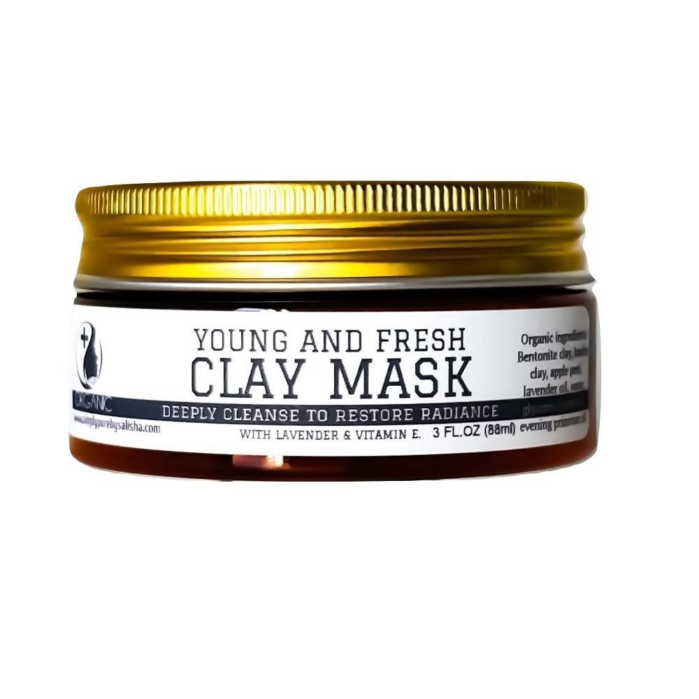 Vitamin E Young And Fresh Clay Mask in a jar with a smooth texture, showcasing its creamy consistency and natural ingredients.
