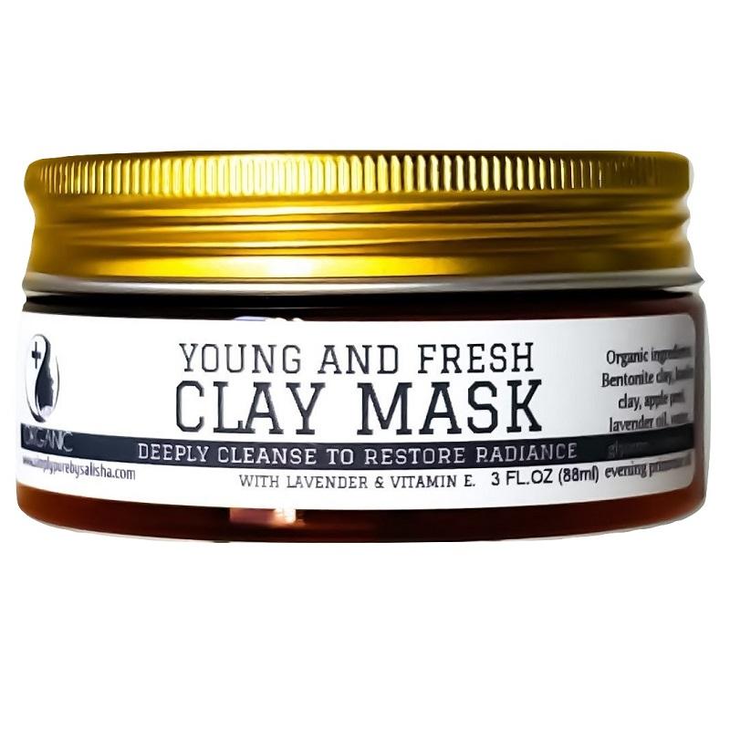Vitamin E Young And Fresh Clay Mask in a jar with a smooth texture, showcasing its creamy consistency and natural ingredients.