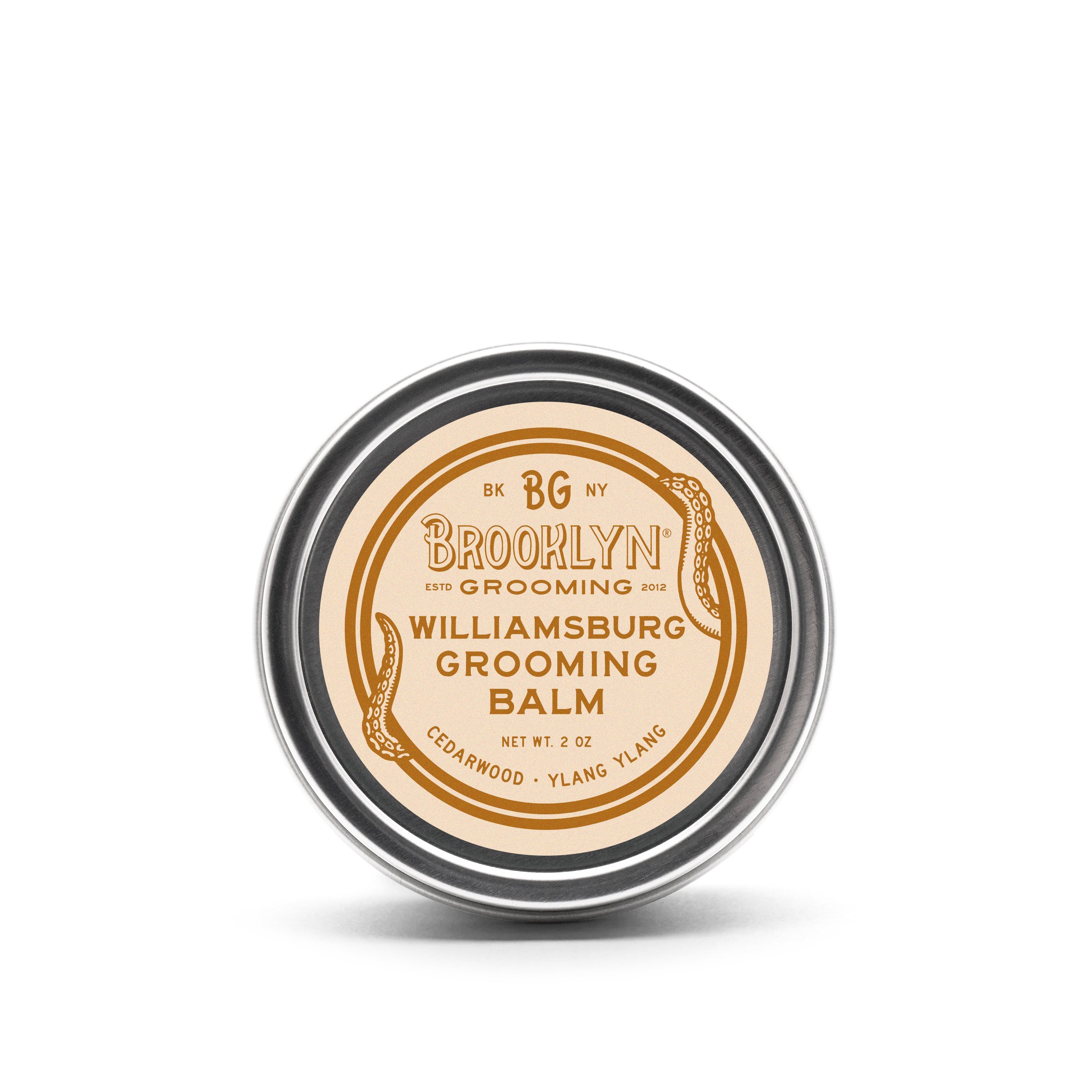 Williamsburg Grooming Balm in a sleek aluminum tin, showcasing its natural ingredients and woodsy scent.